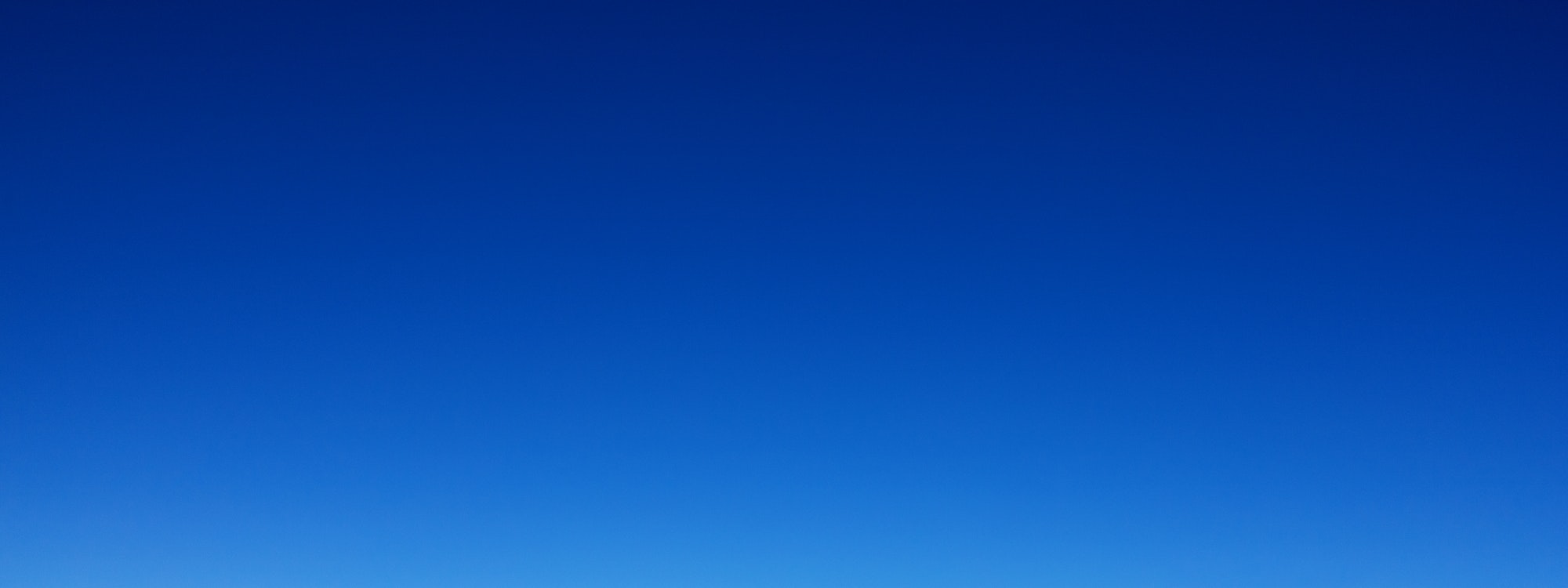 Blue gradient cold sky in the Alps